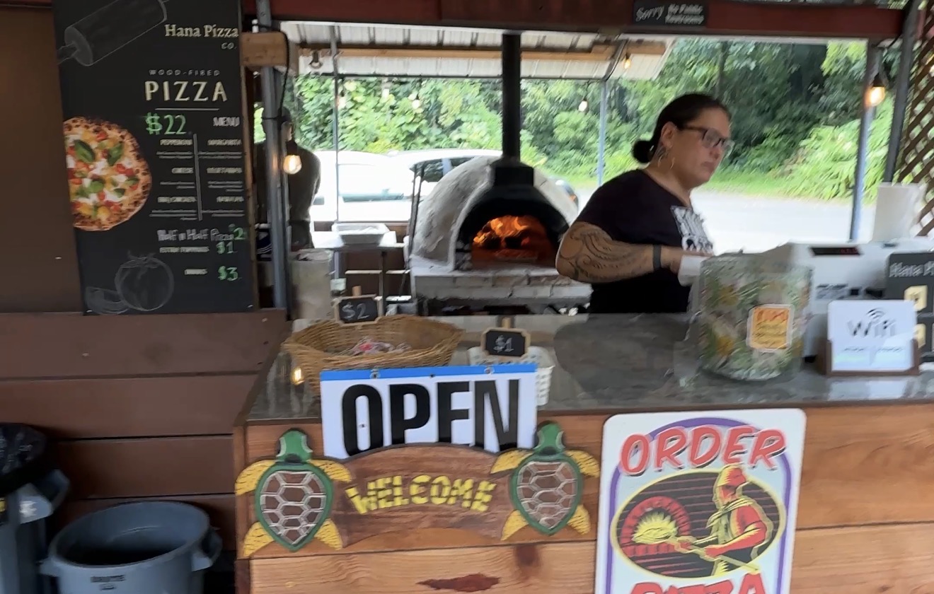 Hana Pizza Company counter and wood-fired pizza oven at Nahiku Marketplace on Maui's Road to HΔna